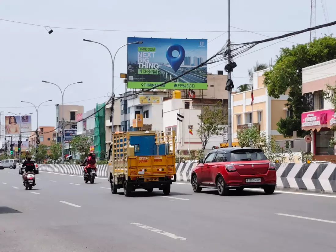 Palavakkam hoarding facing traffic towards Thiruvanmiyur