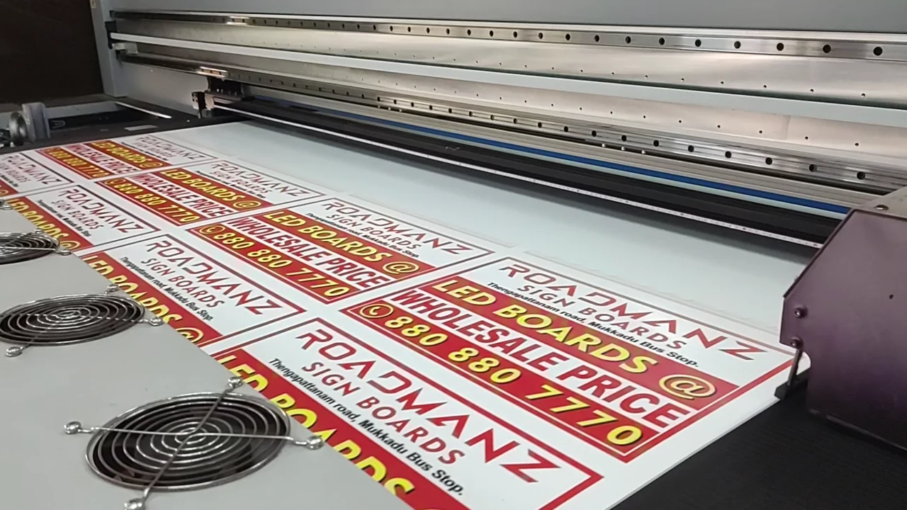 Rigid sign boards running through the flatbed press.